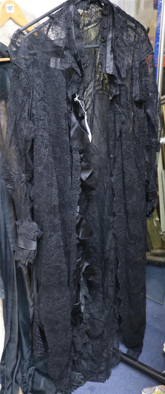A black lace and chiffon dress and a lace opera coat